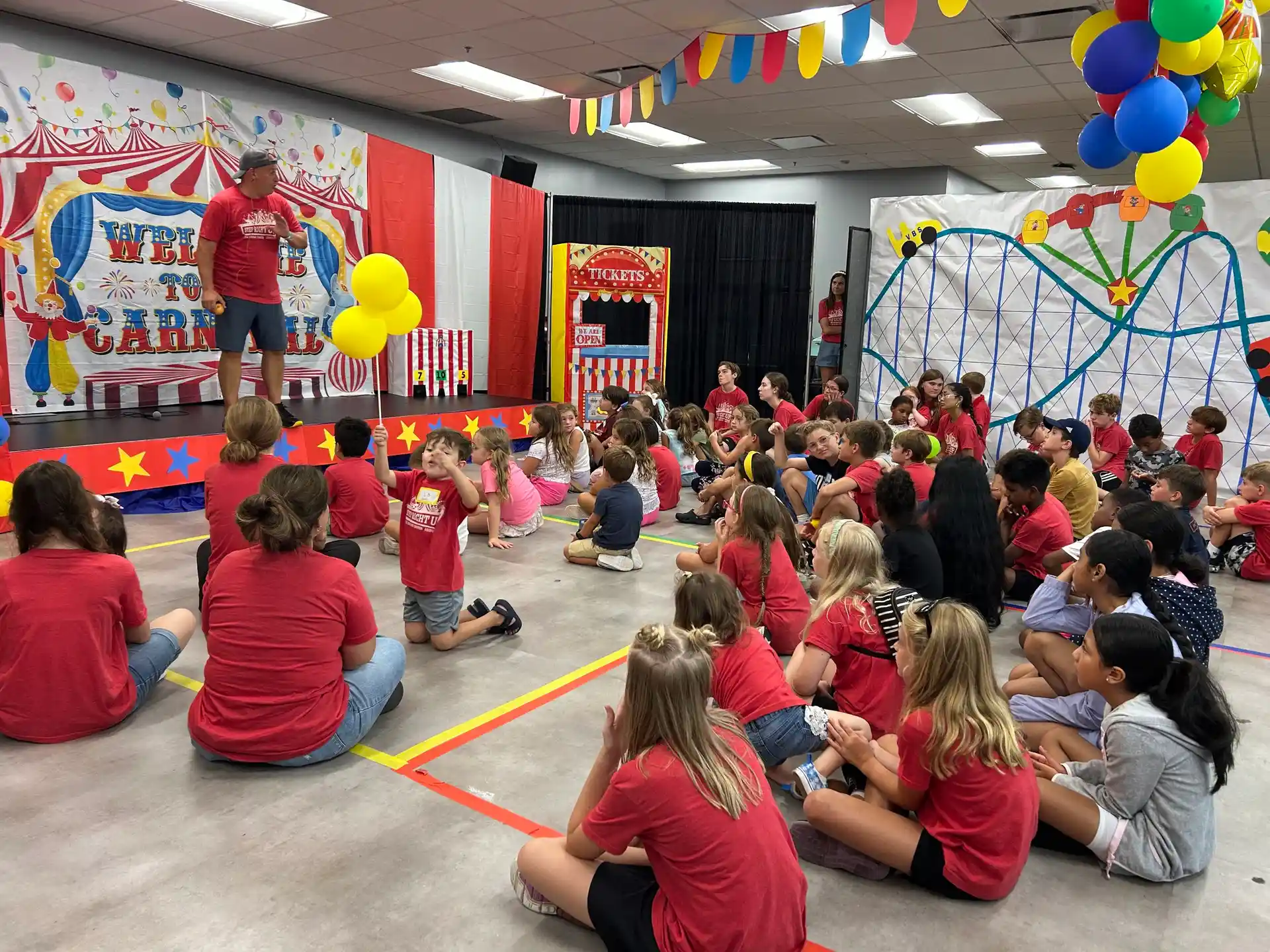 Kids gathered for the Step Right Up VBS carnival kickoff at The Bridge Church