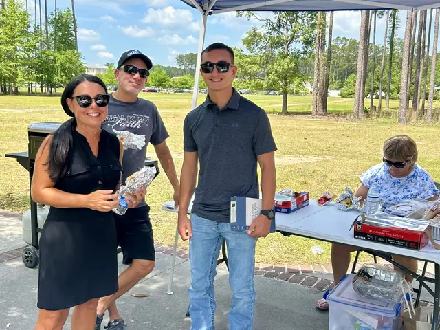 Bridge Teams volunteers serving at an outdoor cookout event